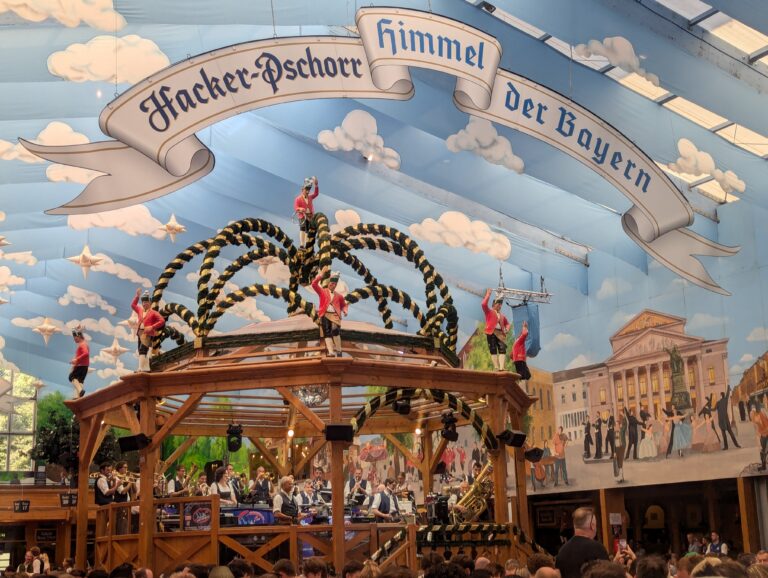 Hacker-Pschorr Himmel der Bayern tent interior showing the iconic sky-painted ceiling and bandstand