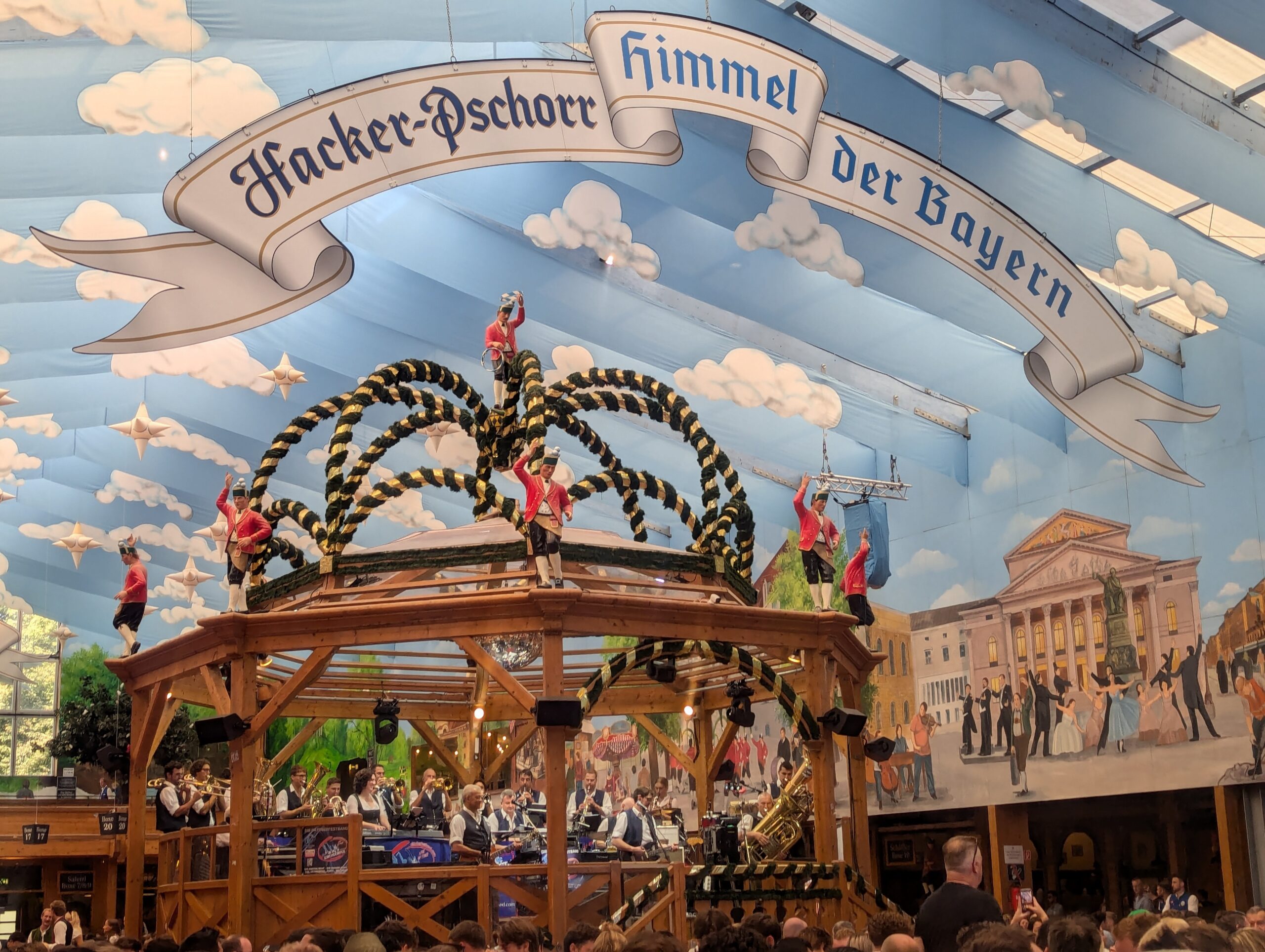 Hacker-Pschorr Himmel der Bayern tent interior showing the iconic sky-painted ceiling and bandstand